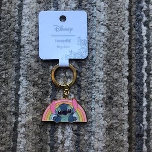 Stitch keychain with a rain bow